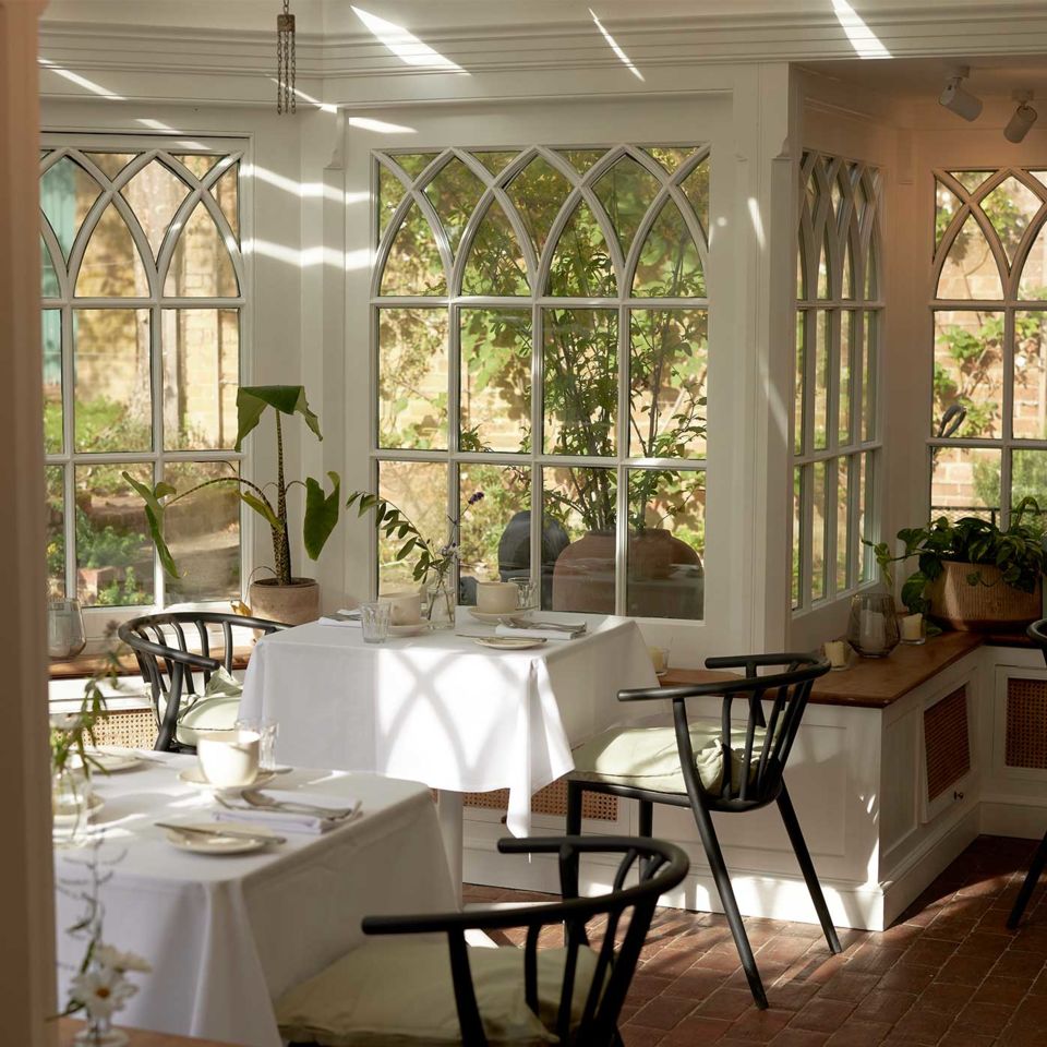 The cosy and intimate farmhouse kitchen-cum- conservatory