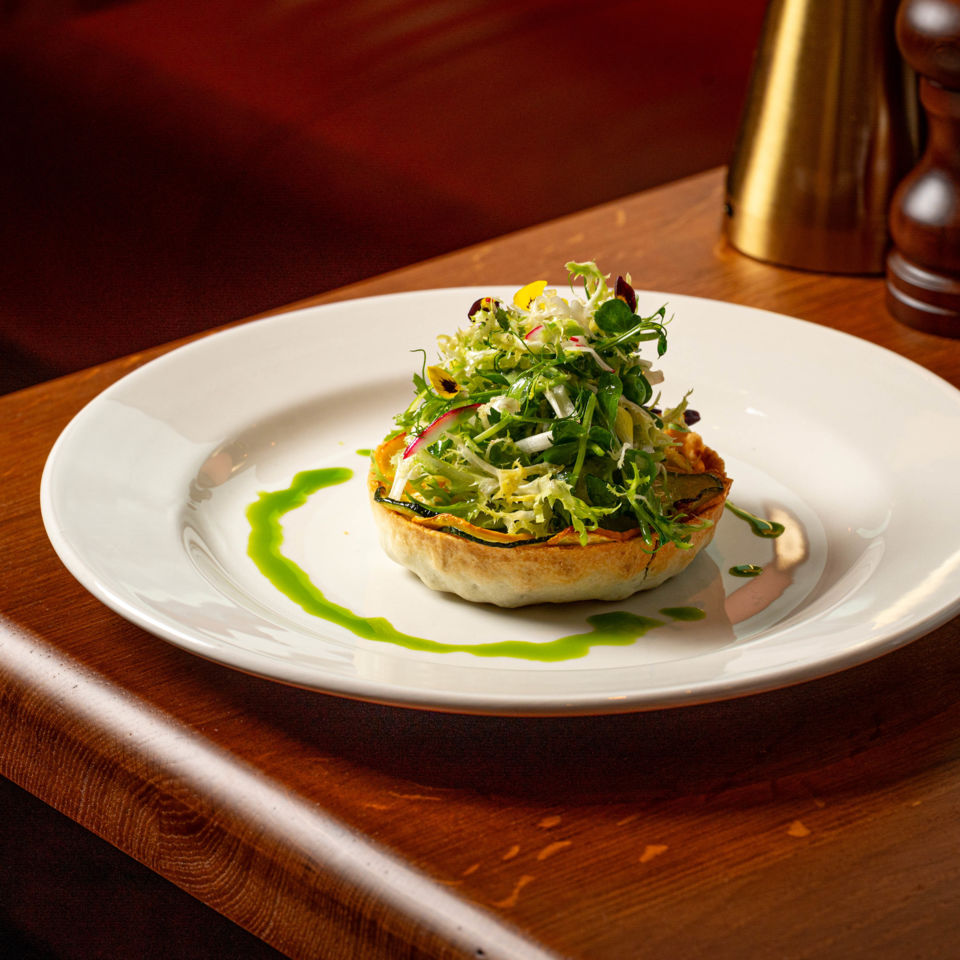 The fresh and vibrant courgette, pea and feta tart