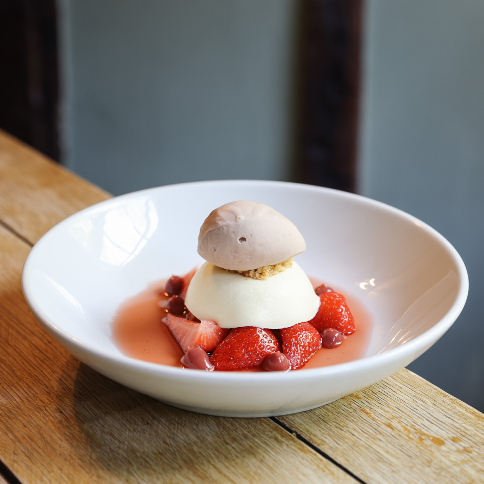 Panna cotta and macerated strawberries for dessert. Image: Mimi Green